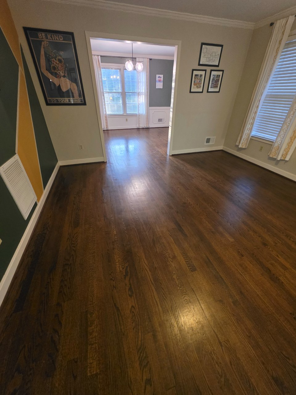 Dark wood floor leading toward a doorway